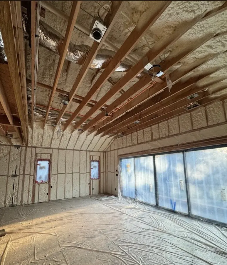 Interior walls and ceiling insulated with spray foam during new construction in Pismo Beach